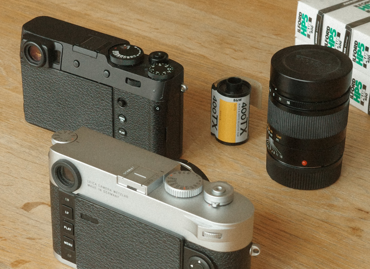 Taped Fujifilm X100V and Leica M10 — analog feeling carried into digital cameras
